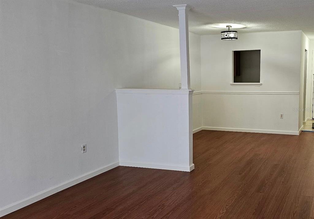 1928 South Conway Road, Unit 17 Orlando, FL 32812 - Photo 11 of 13 a view of a livingroom with wooden floor
