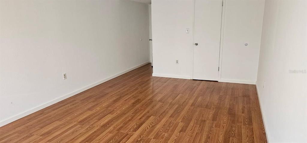 1928 South Conway Road, Unit 17 Orlando, FL 32812 - Photo 12 of 13 a view of a room with wooden floor