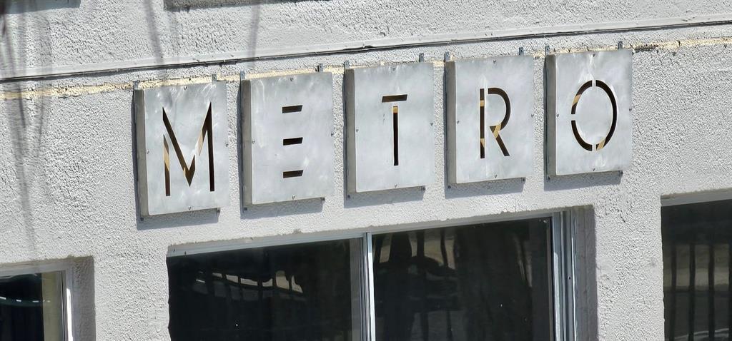 1928 South Conway Road, Unit 17 Orlando, FL 32812 - Photo 6 of 13 a bathroom with a double vanity sink a mirror a shower and a bathtub