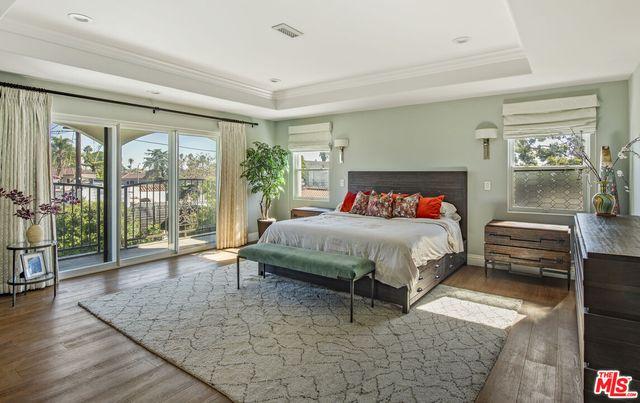 a bedroom with a large bed and a couch