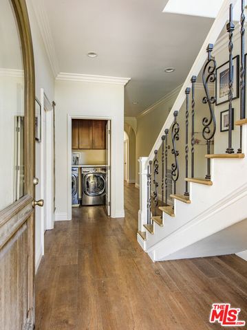 a view of a hallway view with staircase