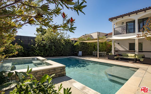 a view of a swimming pool with a patio