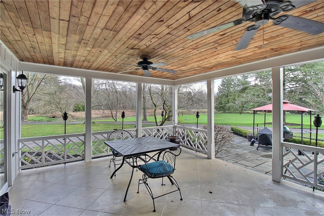 6715 Eagle Road Willoughby, OH 44094 - Photo 10 of 22 Porch with ceiling fan and wood ceiling