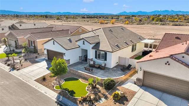 an aerial view of a house with a ocean view