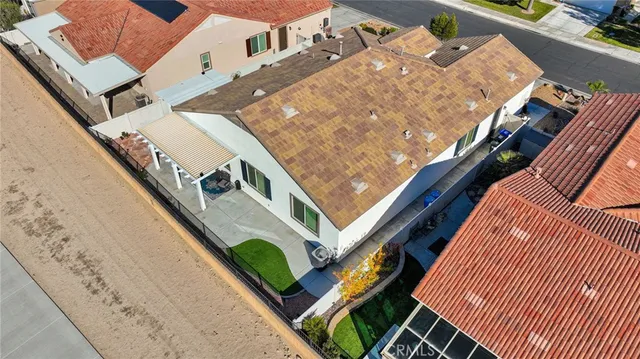 an aerial view of a house with a garden