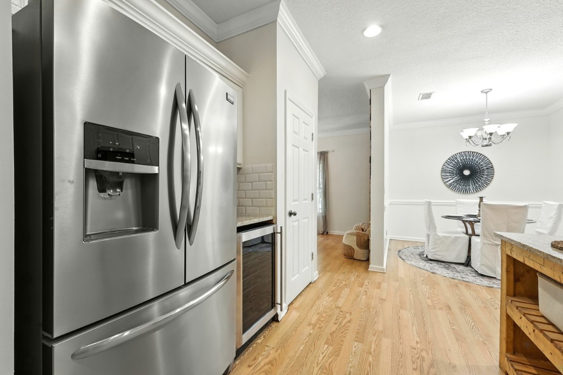 86168 Remsenburg Drive Fernandina Beach, FL 32034 - Photo 11 of 68 a kitchen with stainless steel appliances a refrigerator and a stove