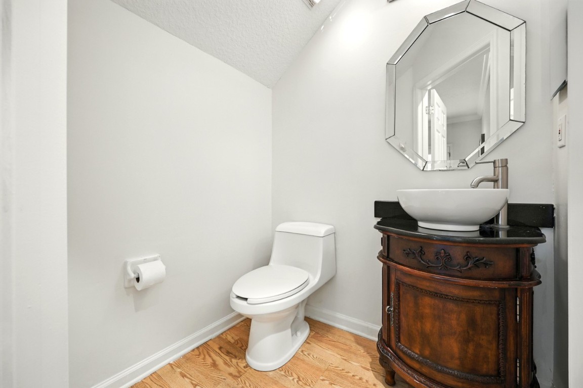 86168 Remsenburg Drive Fernandina Beach, FL 32034 - Photo 19 of 68 a close view of a toilet and a mirror