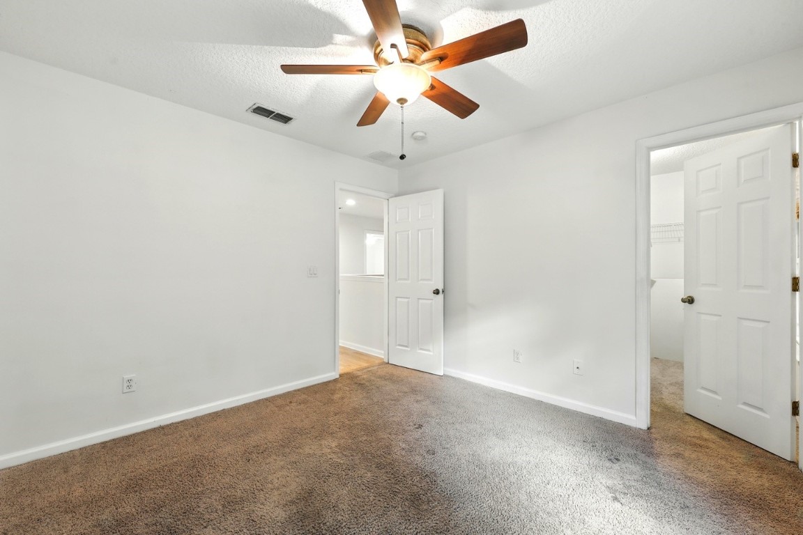 86168 Remsenburg Drive Fernandina Beach, FL 32034 - Photo 20 of 68 an empty room with chandelier fan