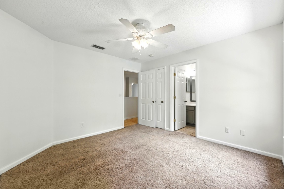 86168 Remsenburg Drive Fernandina Beach, FL 32034 - Photo 29 of 68 an empty room with closet and ceiling fan