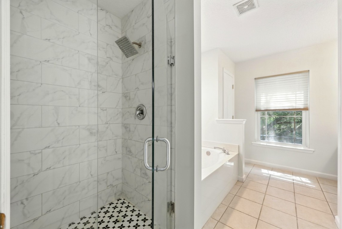 86168 Remsenburg Drive Fernandina Beach, FL 32034 - Photo 33 of 68 a bathroom with a bathtub and shower