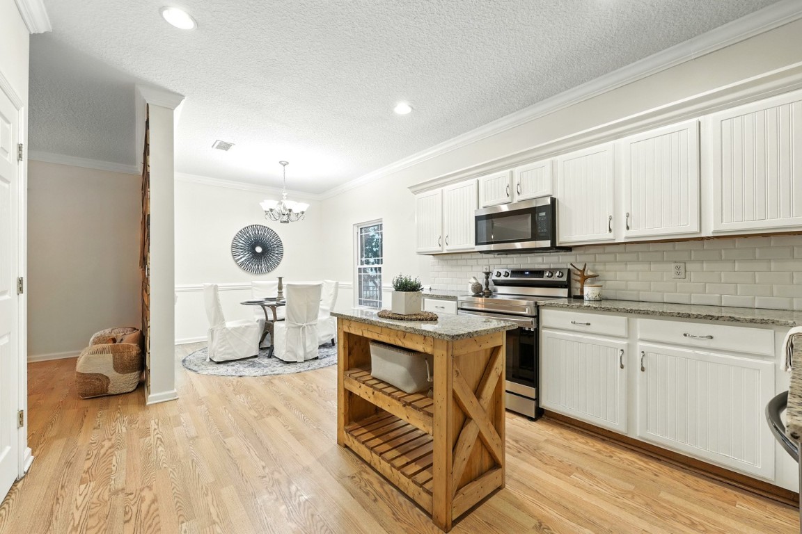 86168 Remsenburg Drive Fernandina Beach, FL 32034 - Photo 9 of 68 a kitchen with a sink cabinets and wooden floor