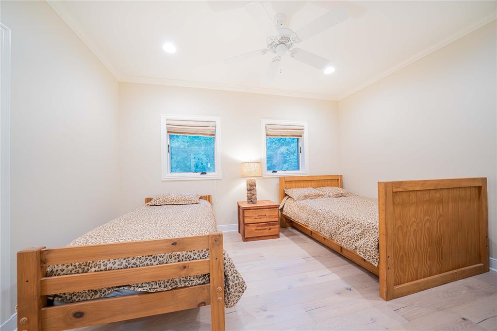 582 Windy Point Mount Vernon, TX 75457 - Photo 33 of 38 Bedroom featuring ornamental molding, light wood-type flooring, recessed lighting, and a ceiling fan