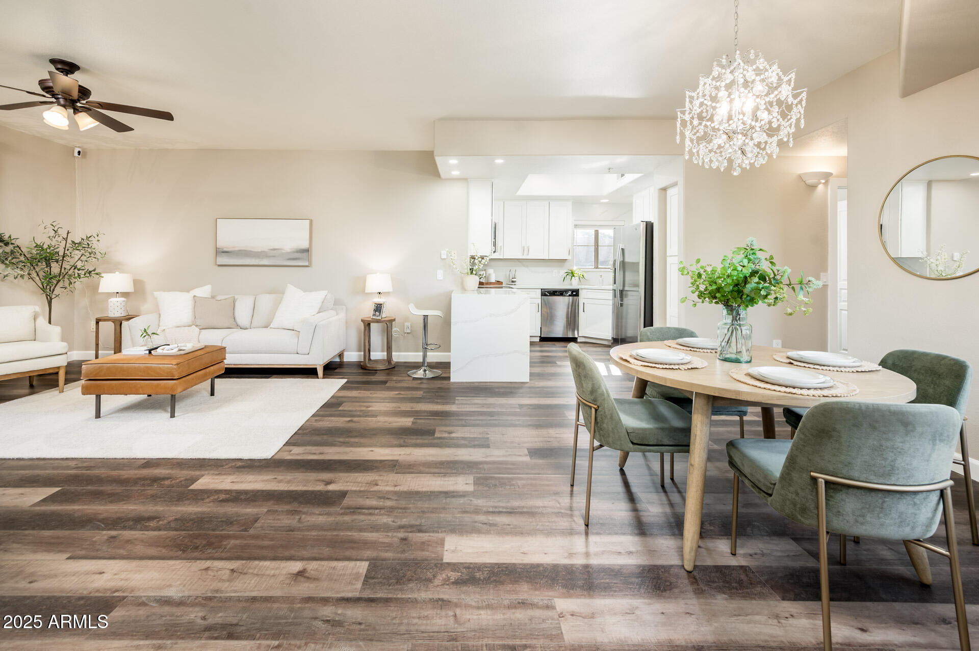 a view of a dining room with furniture and chandelier
