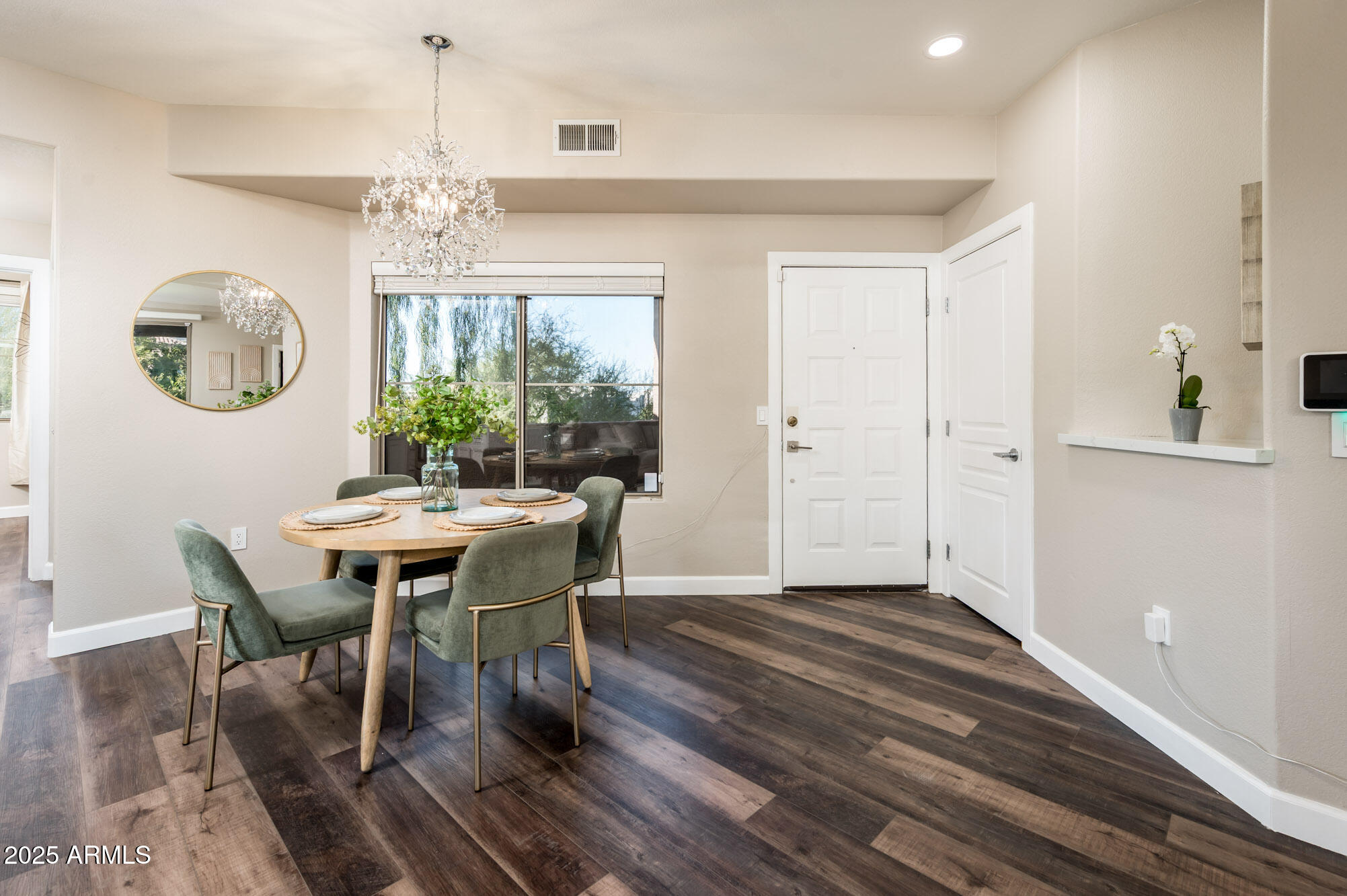 11680 East Sahuaro Drive, Unit 2021 Scottsdale, AZ 85259 - Photo 16 of 51 a view of a dining room with furniture window and wooden floor