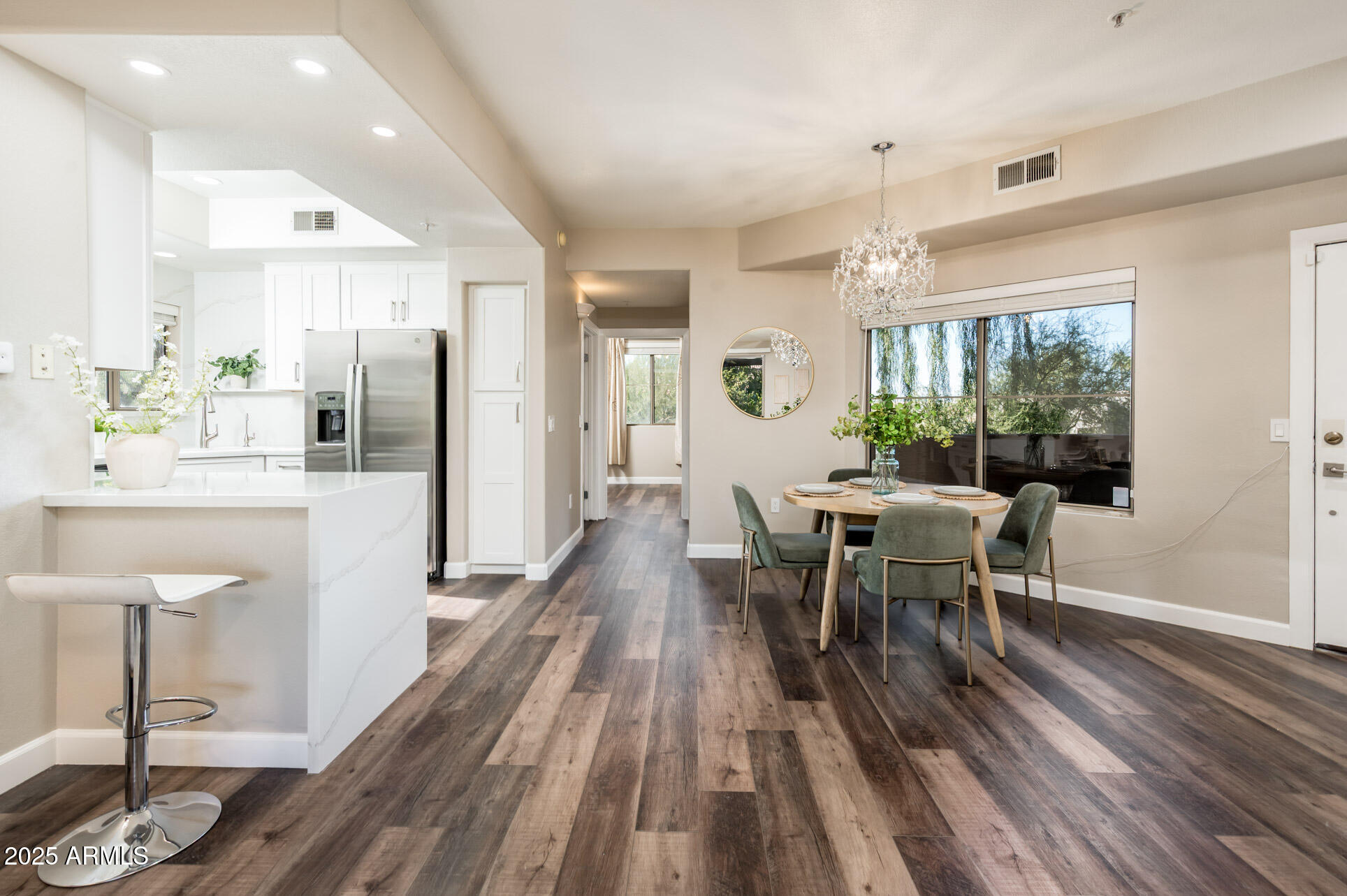 11680 East Sahuaro Drive, Unit 2021 Scottsdale, AZ 85259 - Photo 17 of 51 a view of a dining room with furniture window and wooden floor