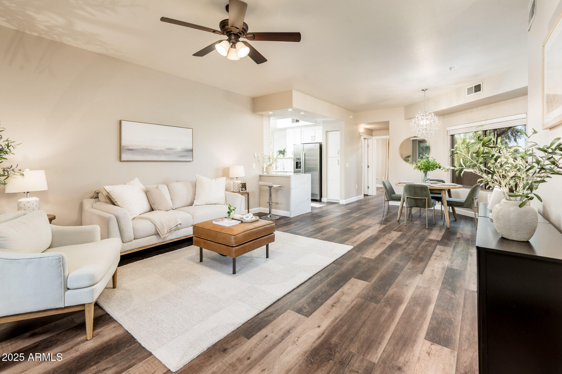 11680 East Sahuaro Drive, Unit 2021 Scottsdale, AZ 85259 - Photo 21 of 51 a living room with furniture and a wooden floor
