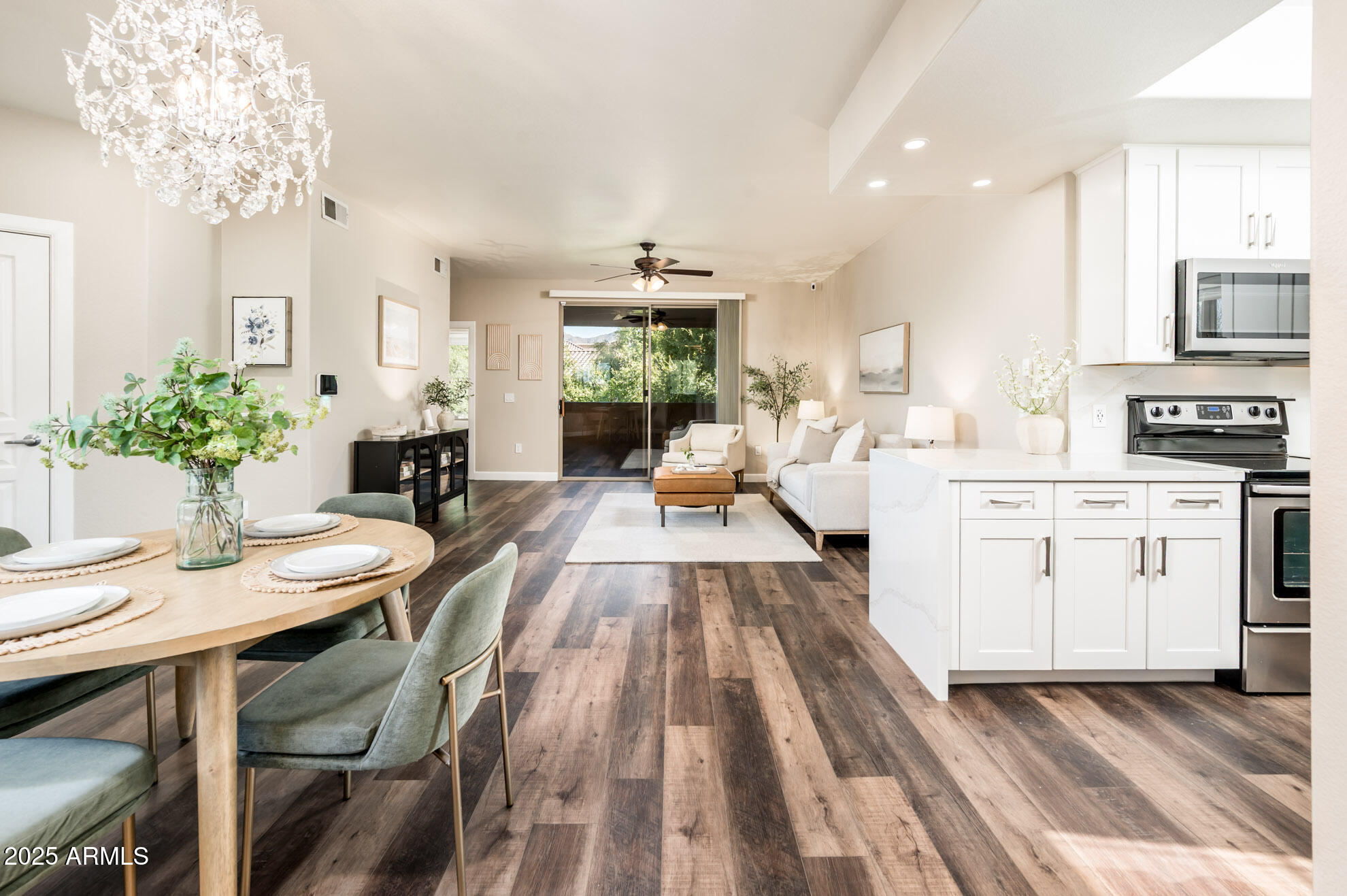 11680 East Sahuaro Drive, Unit 2021 Scottsdale, AZ 85259 - Photo 24 of 51 a living room with stainless steel appliances kitchen island furniture and a chandelier