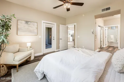 a spacious bathroom with a double vanity sink a mirror and a shower