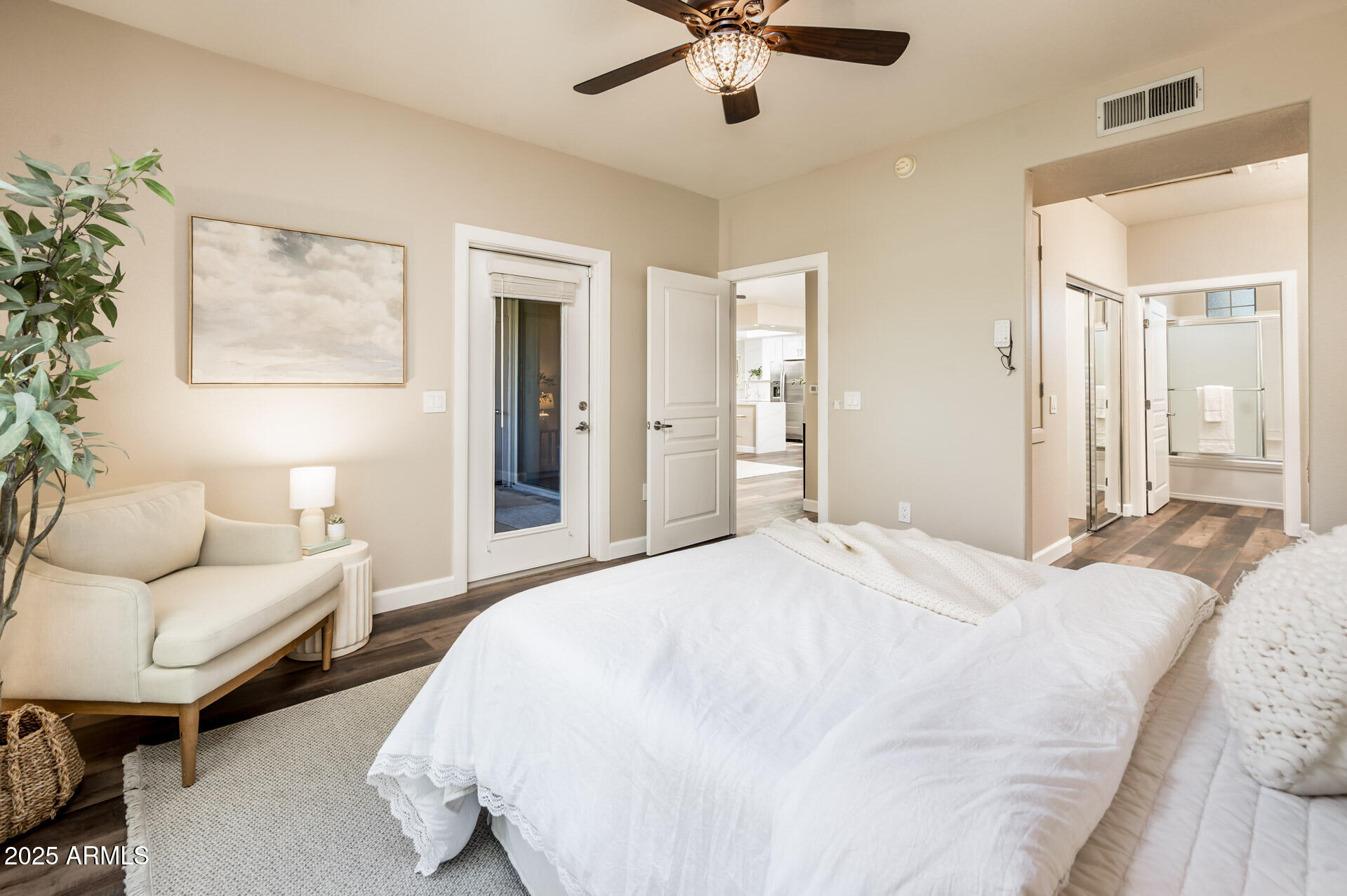 11680 East Sahuaro Drive, Unit 2021 Scottsdale, AZ 85259 - Photo 30 of 51 a spacious bedroom with a bed and ceiling fan