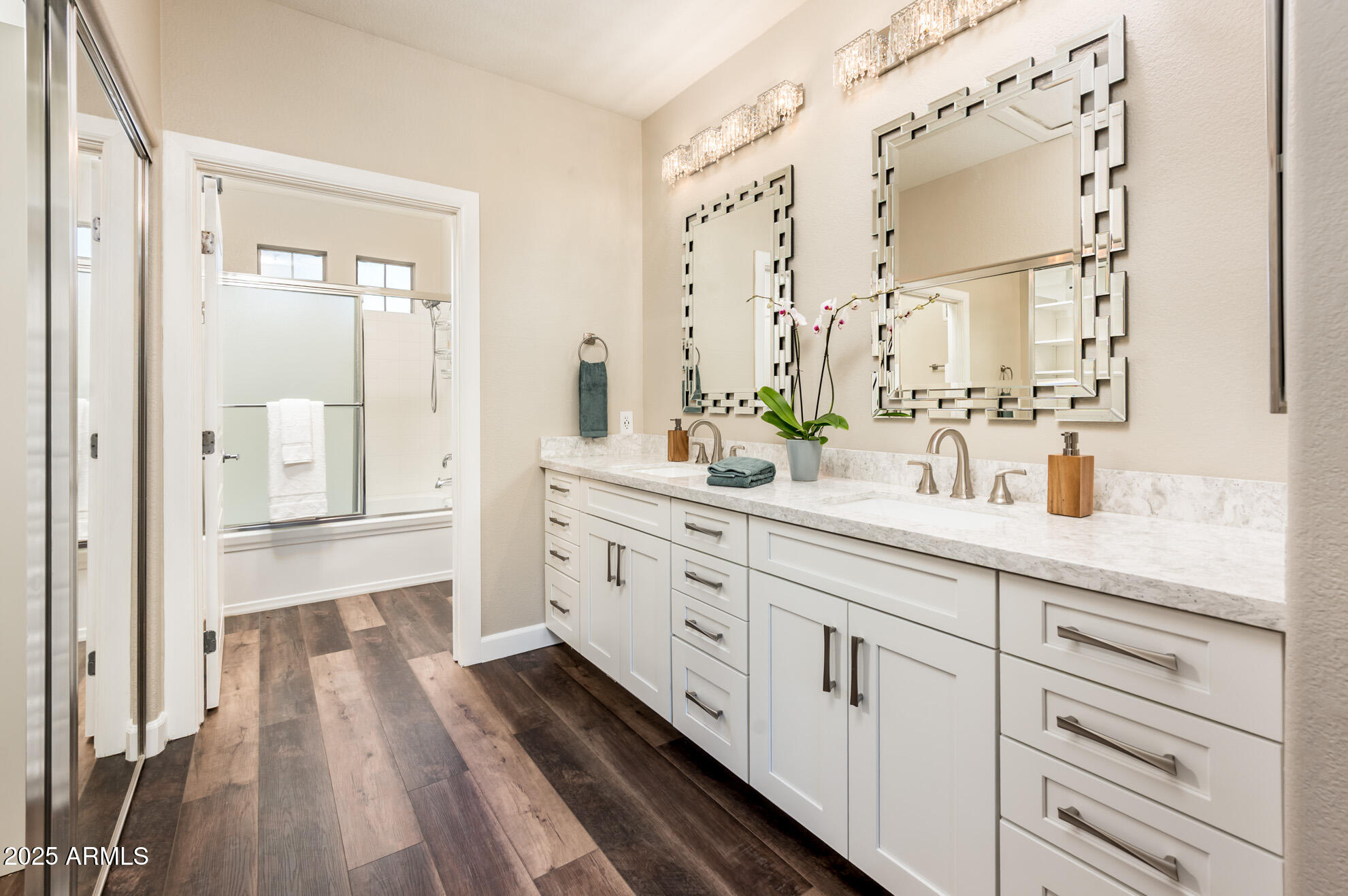 11680 East Sahuaro Drive, Unit 2021 Scottsdale, AZ 85259 - Photo 31 of 51 a spacious bathroom with a double vanity sink a mirror and a shower