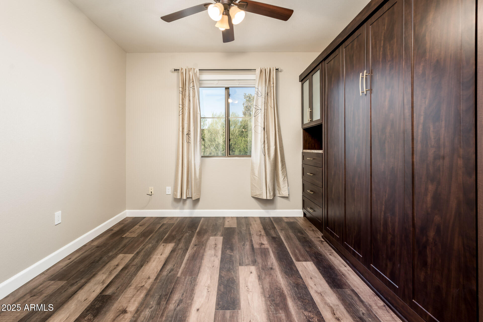 11680 East Sahuaro Drive, Unit 2021 Scottsdale, AZ 85259 - Photo 36 of 51 a view of a room with wooden floor fan and windows