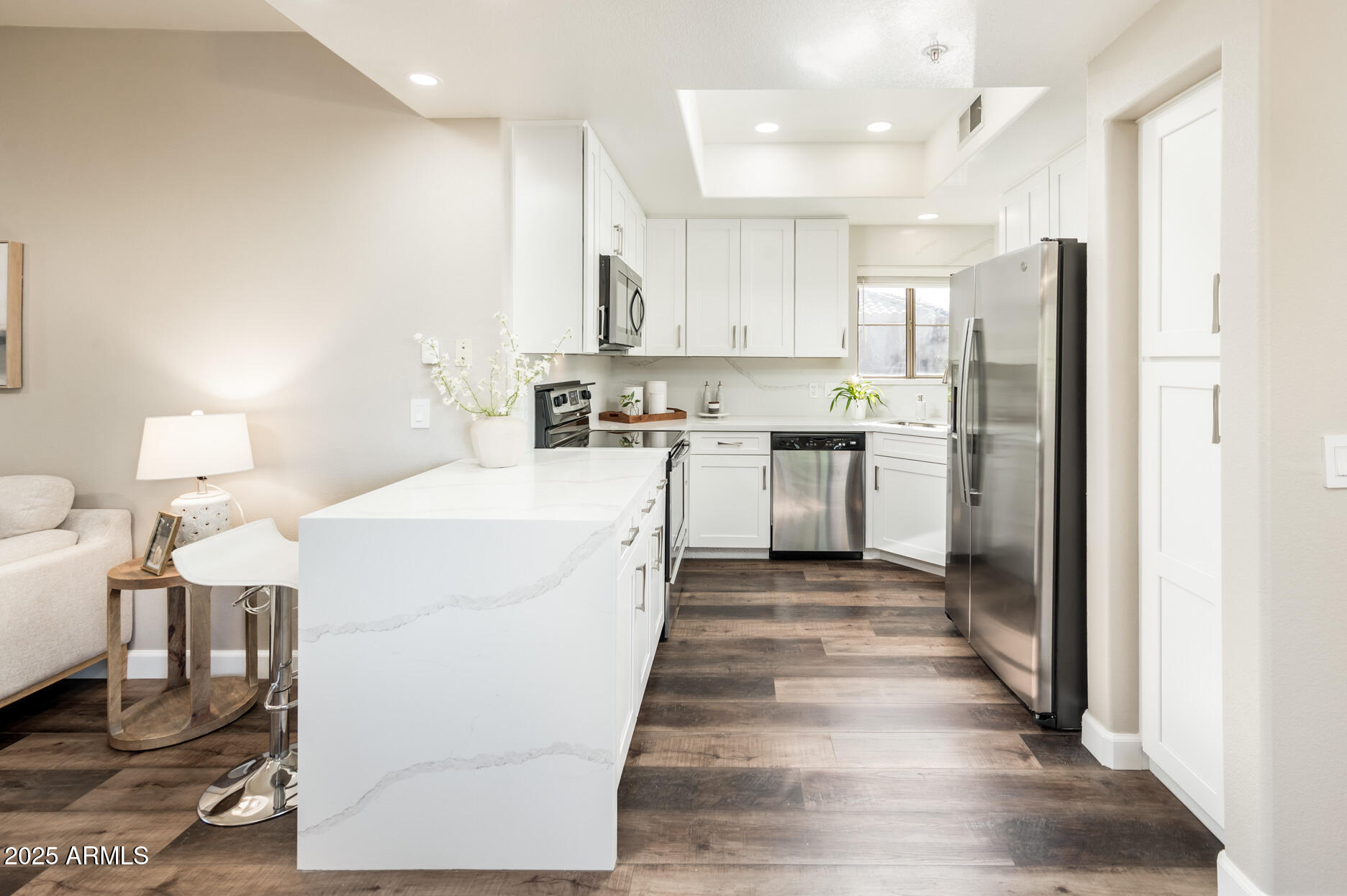 11680 East Sahuaro Drive, Unit 2021 Scottsdale, AZ 85259 - Photo 3 of 51 a large white kitchen with cabinets a sink and appliances