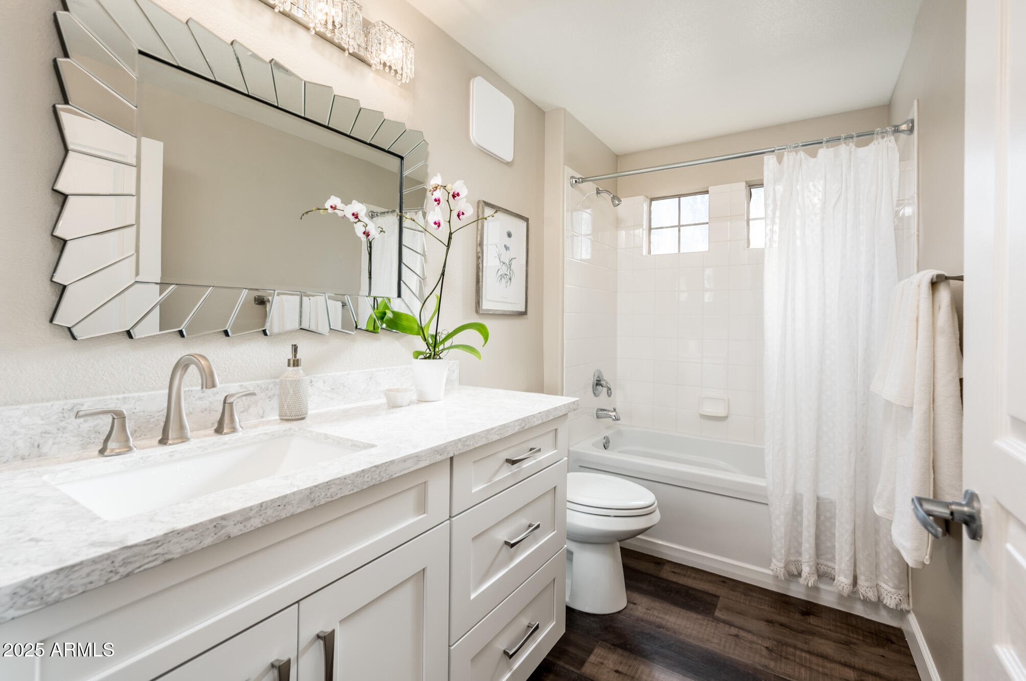11680 East Sahuaro Drive, Unit 2021 Scottsdale, AZ 85259 - Photo 40 of 51 a bathroom with a granite countertop sink a toilet a large mirror and shower