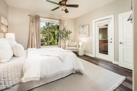 a bedroom with a large bed and a window