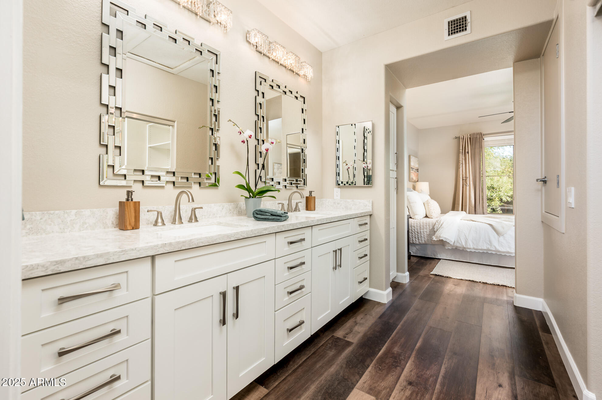 11680 East Sahuaro Drive, Unit 2021 Scottsdale, AZ 85259 - Photo 5 of 51 a spacious en suite bathroom with double sink and a large mirror