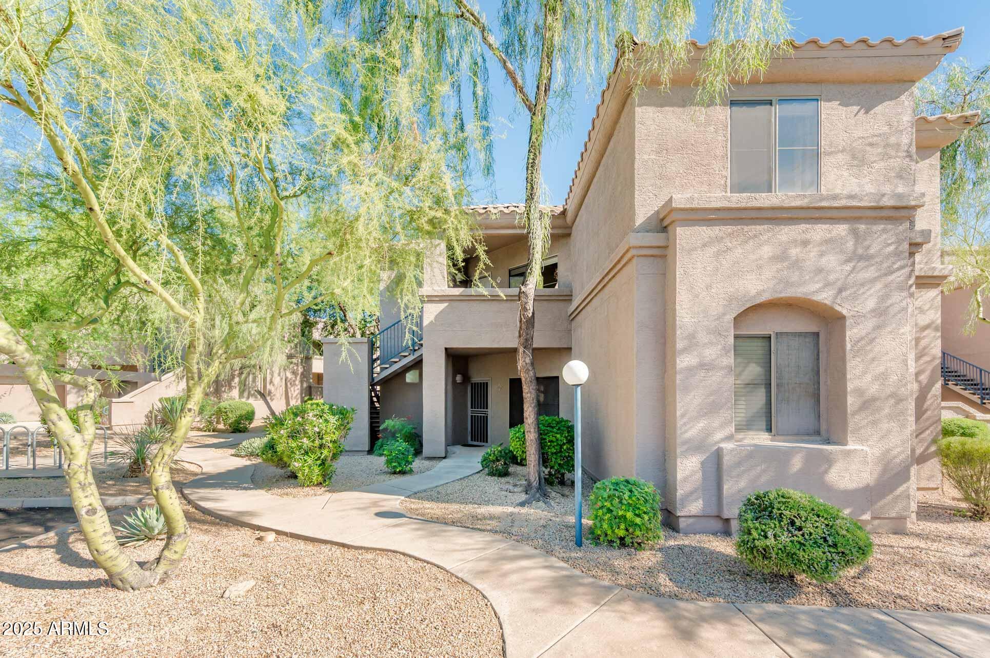 11680 East Sahuaro Drive, Unit 2021 Scottsdale, AZ 85259 - Photo 6 of 51 a front view of a house with garden