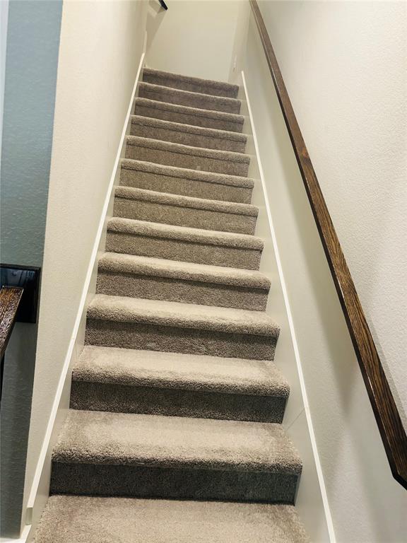 8223 Snapdragon Way Dallas, TX 75252 - Photo 18 of 32 Stairway with a textured wall