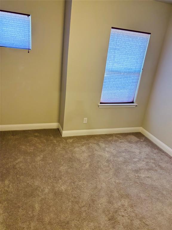 8223 Snapdragon Way Dallas, TX 75252 - Photo 22 of 32 Unfurnished room with carpet floors and baseboards