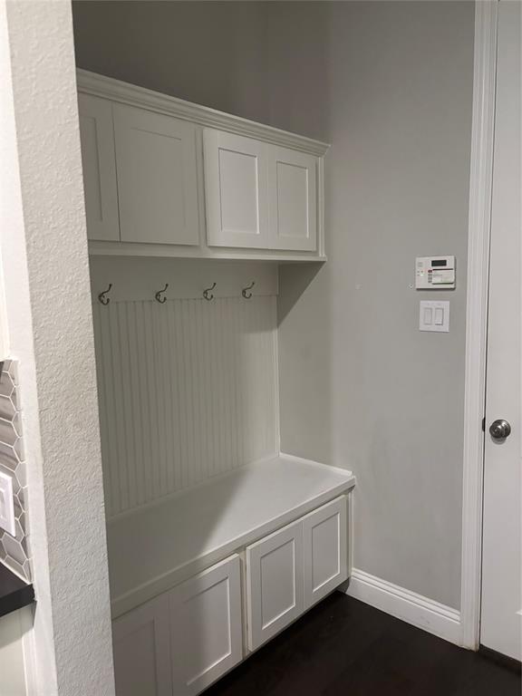 8223 Snapdragon Way Dallas, TX 75252 - Photo 28 of 32 Mudroom featuring baseboards and dark wood-style floors