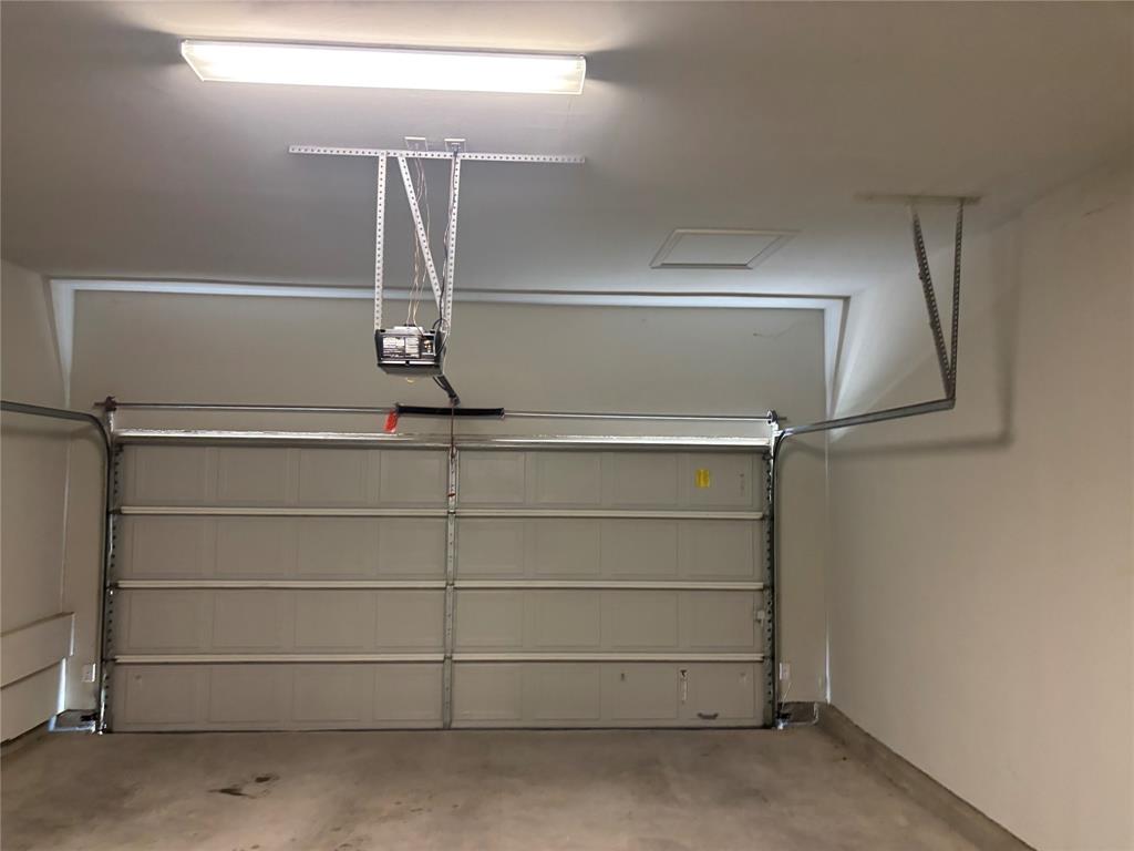 8223 Snapdragon Way Dallas, TX 75252 - Photo 30 of 32 Garage with a garage door opener