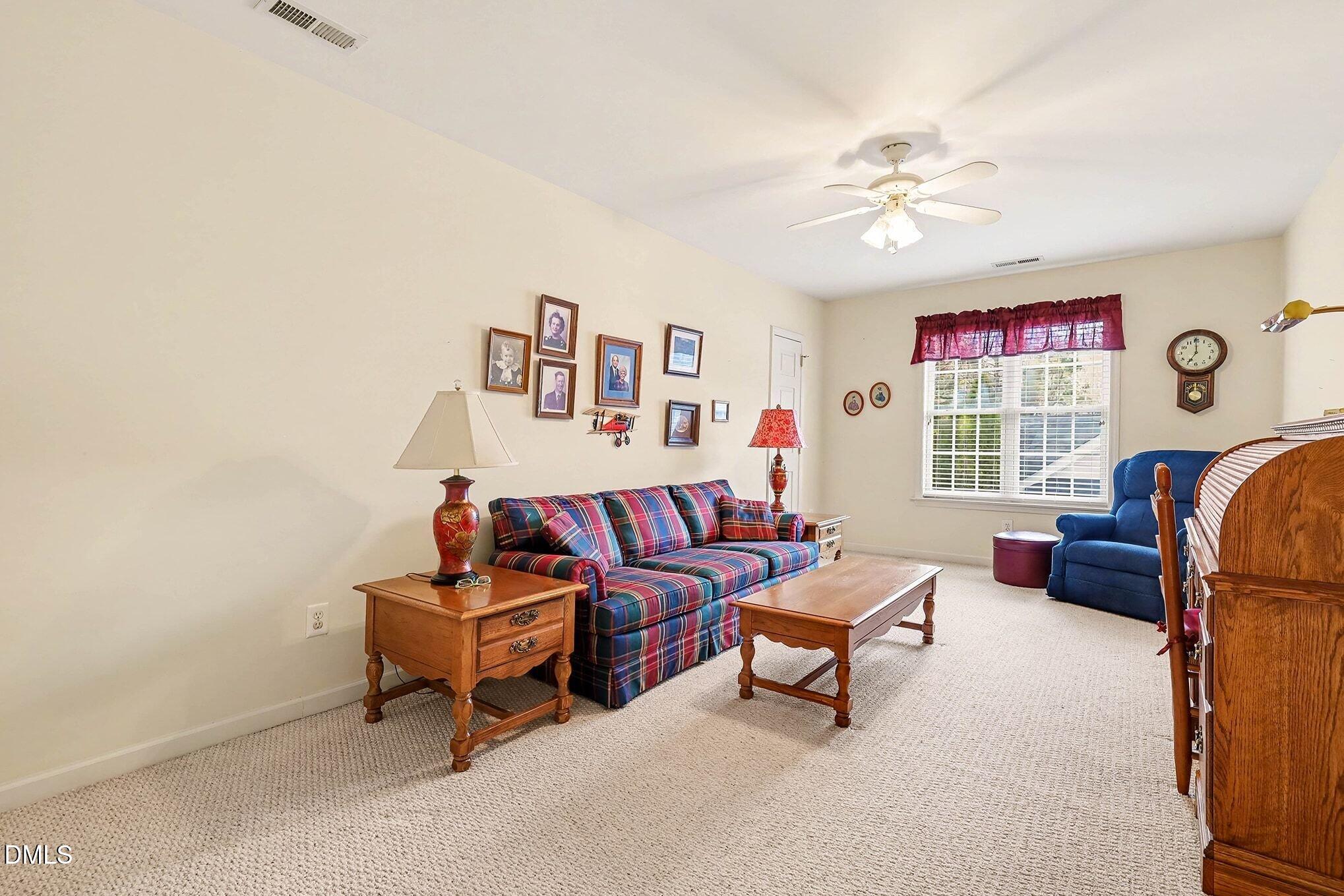 411 Latta Circle Durham, NC 27712 - Photo 26 of 36 a living room with furniture and a window