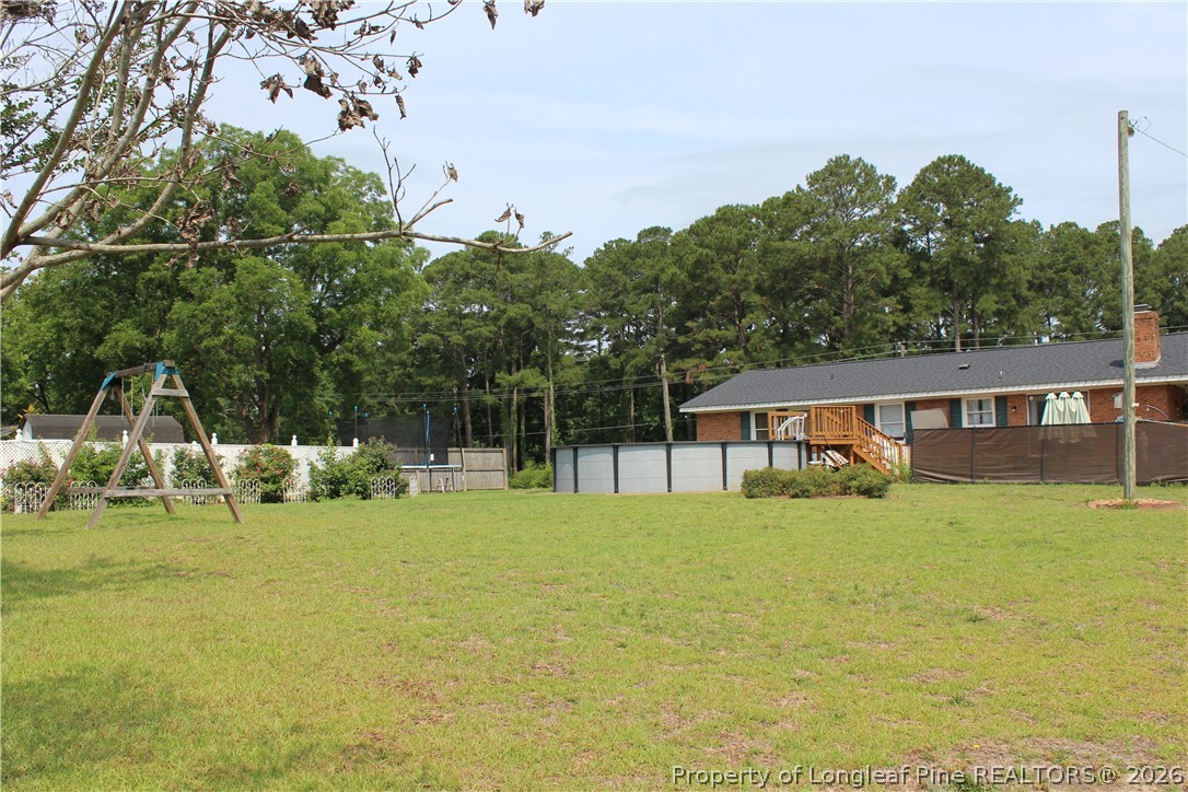 2038 Dunn Road Eastover, NC 28312 - Photo 25 of 29 a view of a house with a yard and sitting area