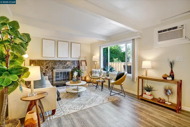 a view of a livingroom with furniture and a window