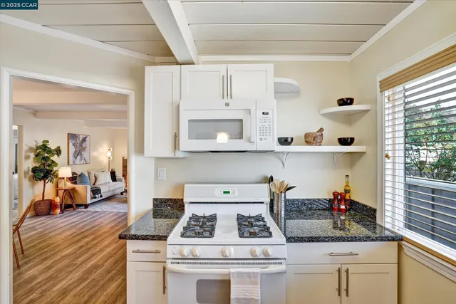 a kitchen with stainless steel appliances a refrigerator and a stove