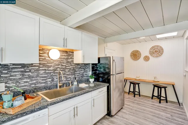 a view of a room with a table and a chair