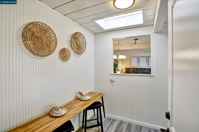 a en suite bathroom with a sink and a mirror