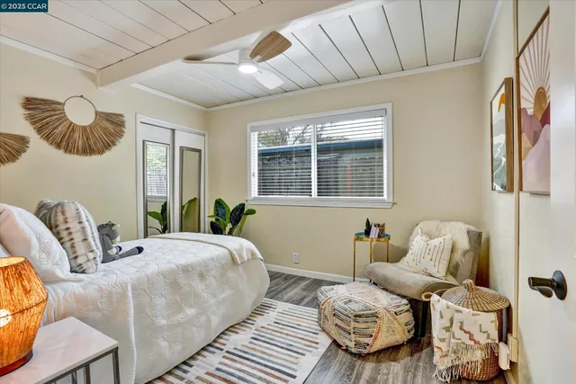 a bedroom with furniture and a window