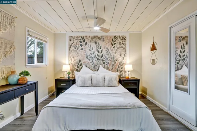 a bedroom that has a bed and a table in it