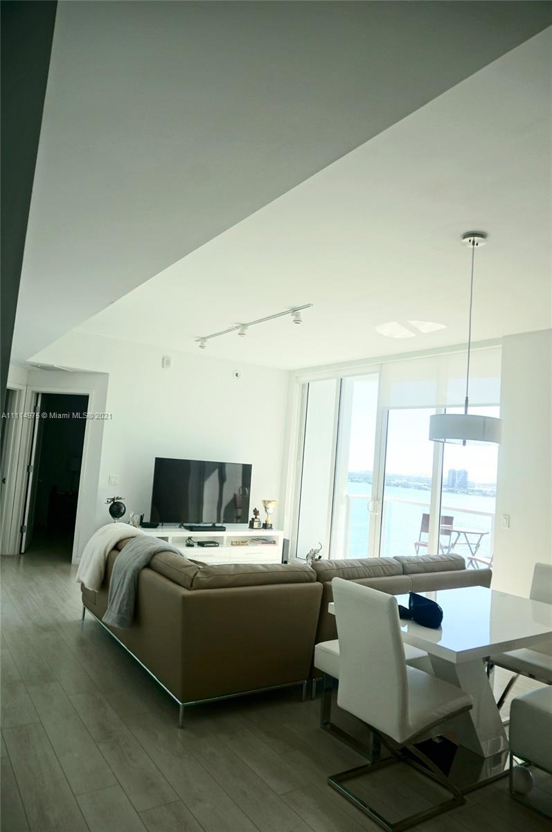 601 Northeast 27th Street, Unit 1604 Miami, FL 33137 - Photo 11 of 47 a living room with furniture and window