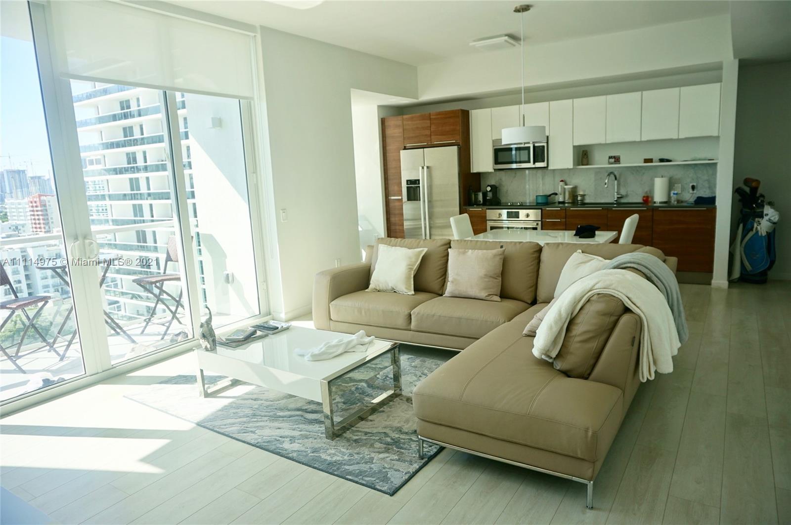 601 Northeast 27th Street, Unit 1604 Miami, FL 33137 - Photo 17 of 47 a living room with furniture and a large window
