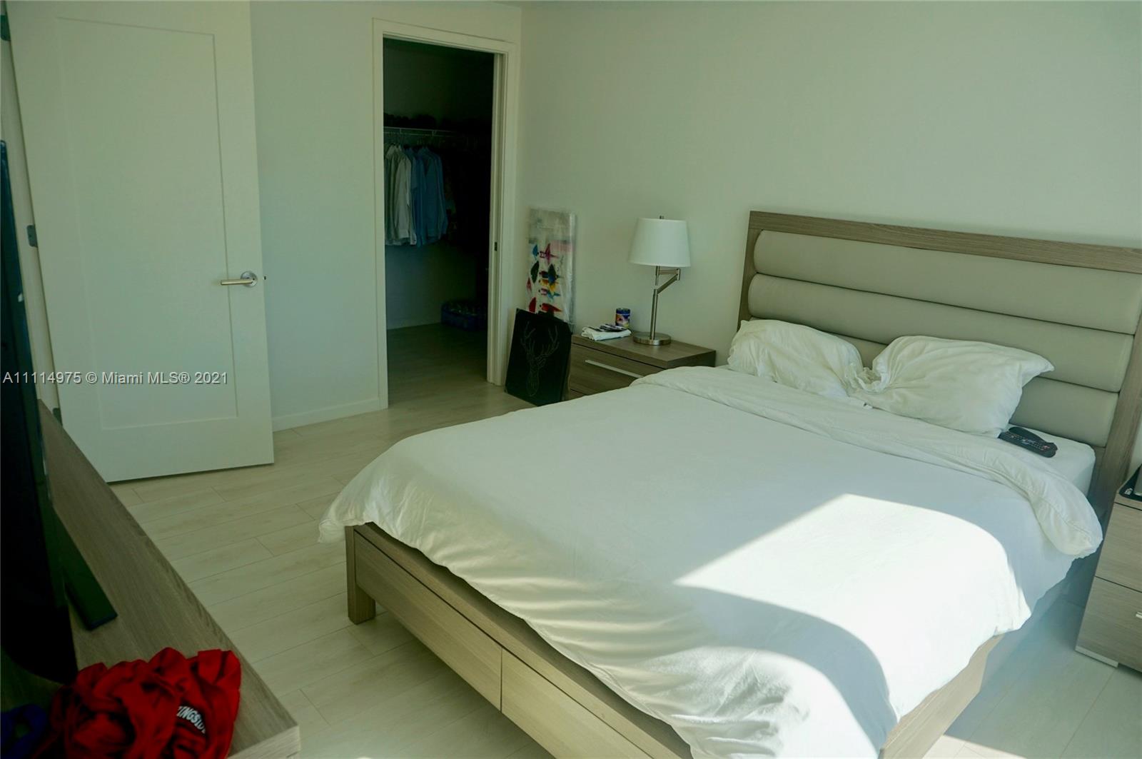 601 Northeast 27th Street, Unit 1604 Miami, FL 33137 - Photo 19 of 47 a large bed sitting in a bedroom next to a window
