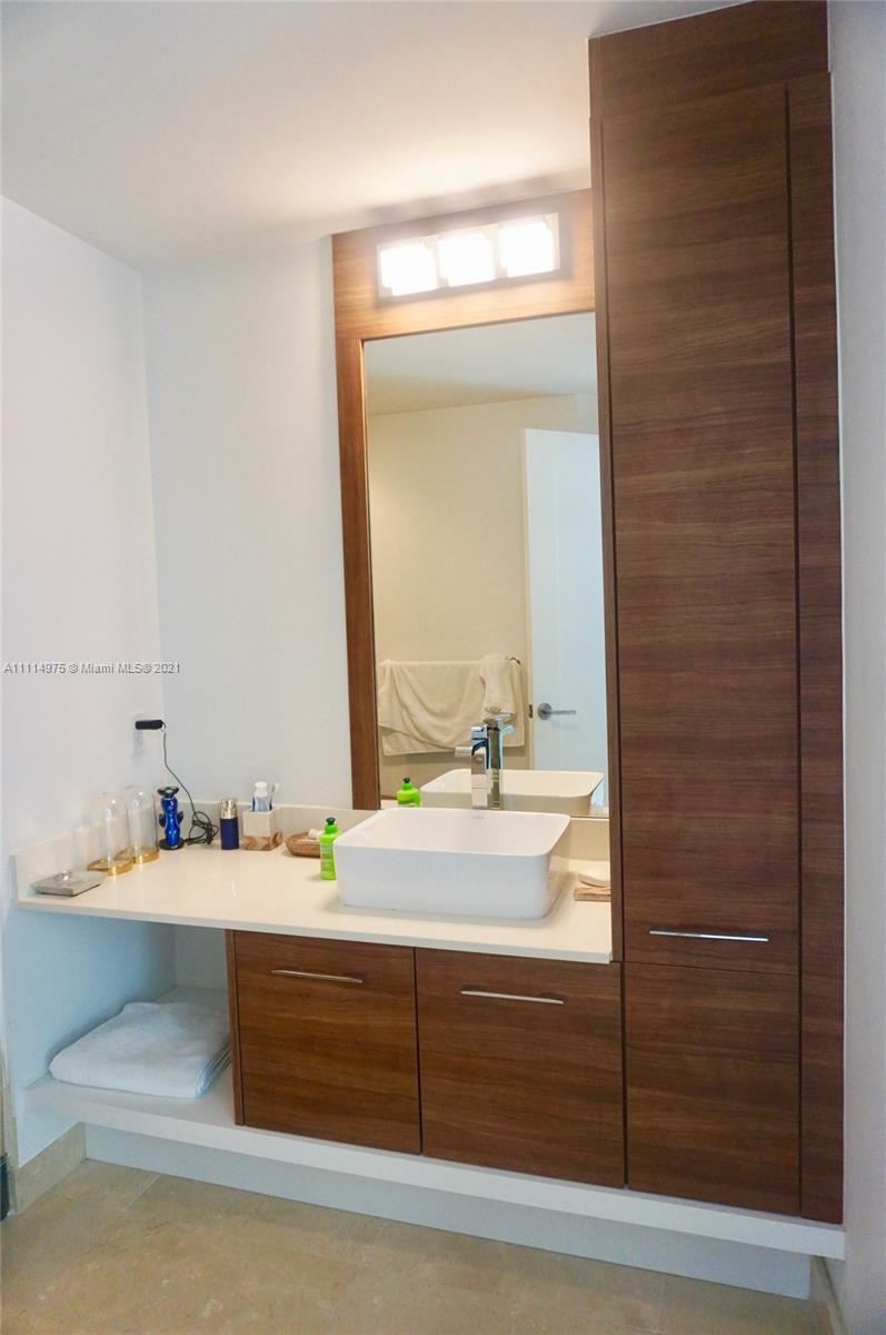 601 Northeast 27th Street, Unit 1604 Miami, FL 33137 - Photo 20 of 47 a bathroom with a sink and a mirror