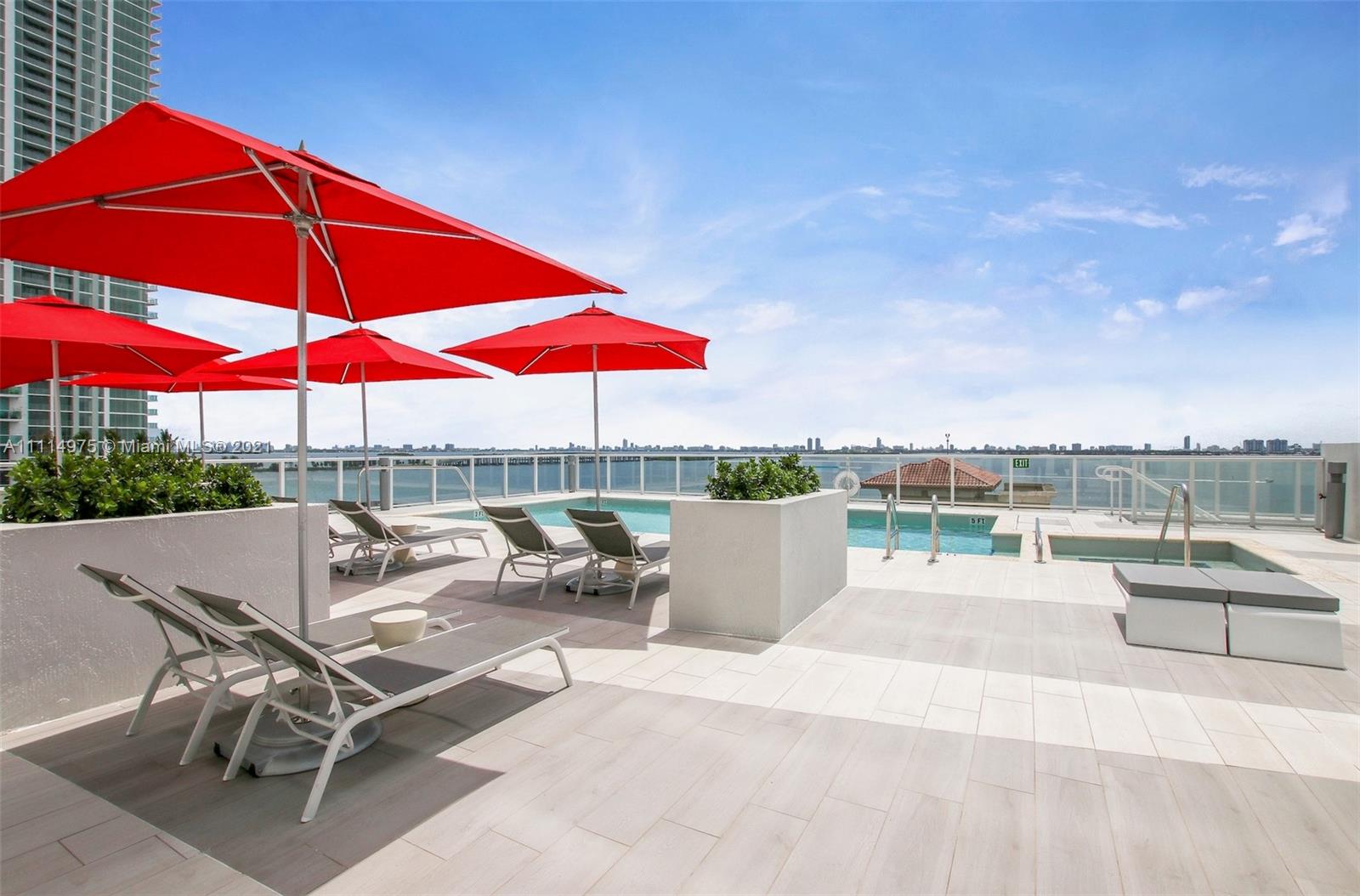 601 Northeast 27th Street, Unit 1604 Miami, FL 33137 - Photo 3 of 47 a view of a terrace with furniture and umbrella