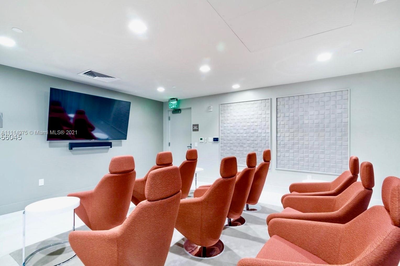 601 Northeast 27th Street, Unit 1604 Miami, FL 33137 - Photo 21 of 47 a projector room with furniture