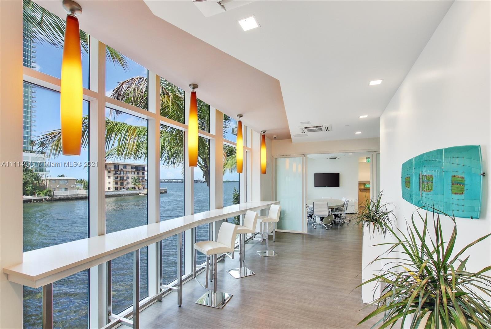 601 Northeast 27th Street, Unit 1604 Miami, FL 33137 - Photo 24 of 47 a living room with furniture floor to ceiling window and wooden floor