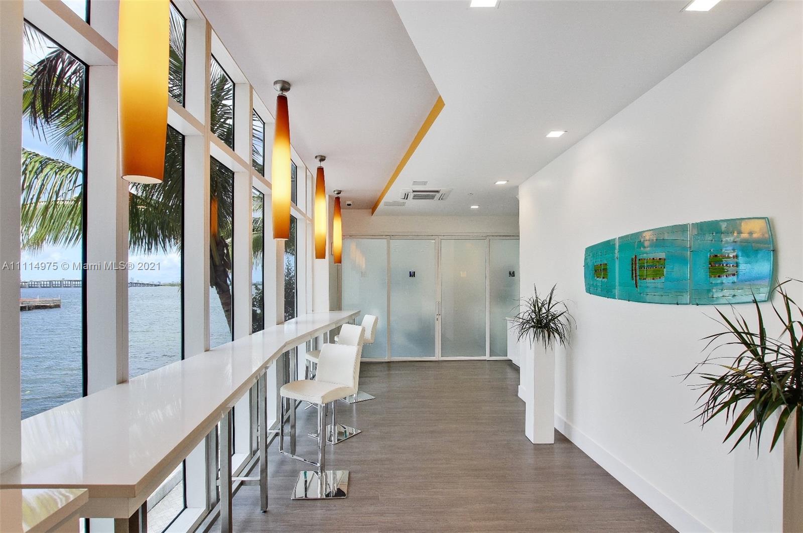 601 Northeast 27th Street, Unit 1604 Miami, FL 33137 - Photo 27 of 47 a living room with furniture and a large window